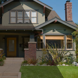 Craftsman-style home with well-maintained landscaping, used to illustrate current home value trends